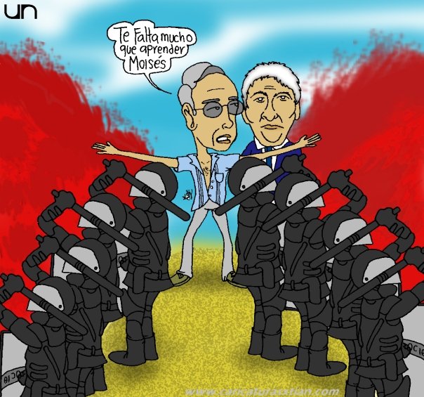 Uribe le dice al rector de la Universidad Nacional: 'Te falta mucho que aprender, Moisés'; enfrente de ellos, agentes del ESMAD rodeados de sangre